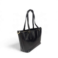 Black leather handbag, back view from the left, House of Enira Isual