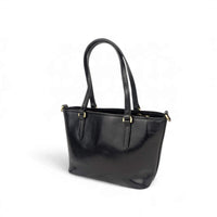 Black leather handbag, back view from the right, House of Enira Isual