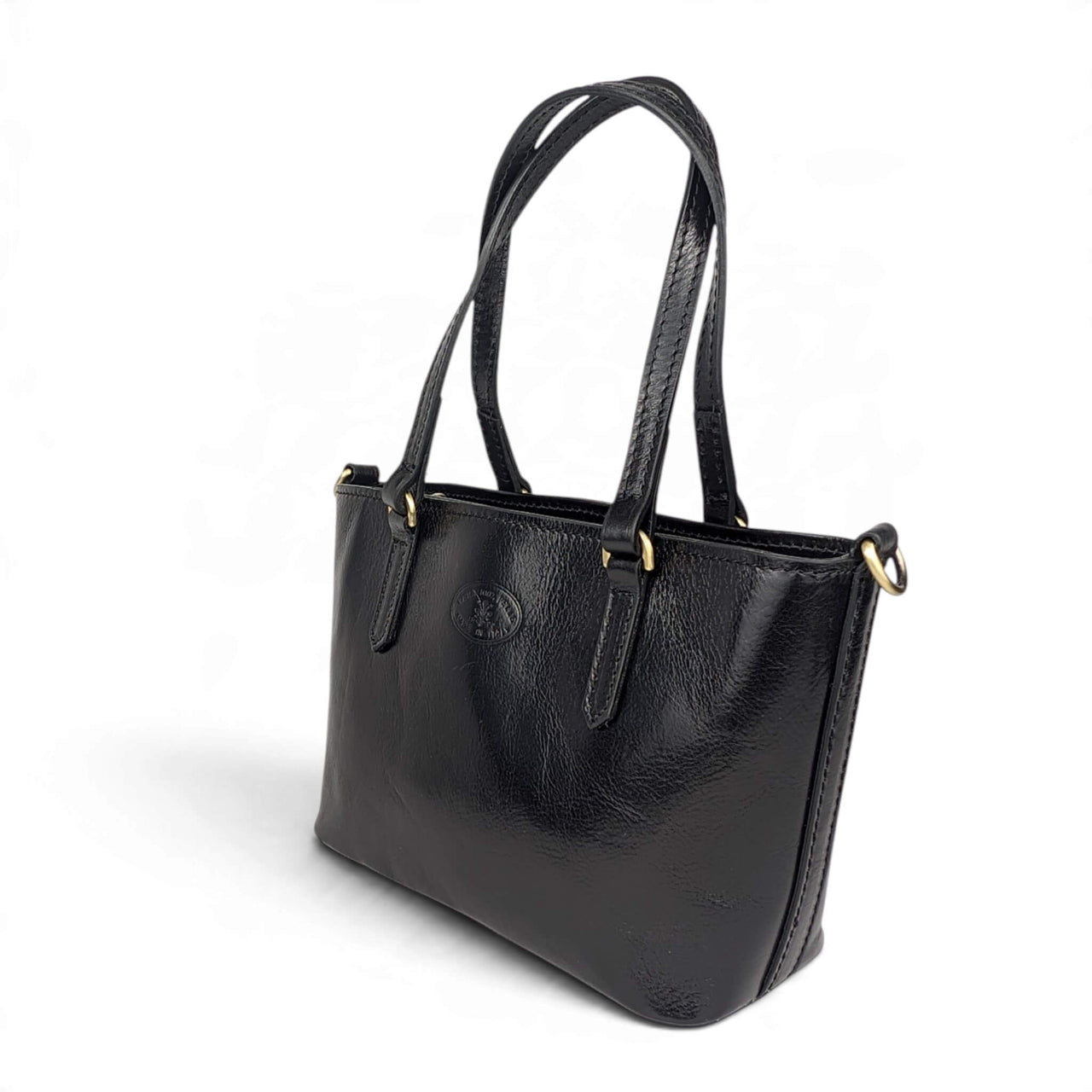 Black leather handbag, front view from the right, House of Enira Isual