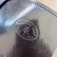 Black leather handbag, close-up of the hardware and Vera Pelle stamp, House of Enira Isual