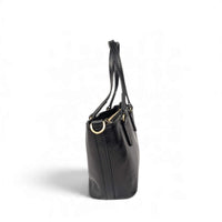 Black leather handbag, side view, House of Enira Isual