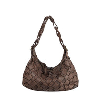 Brown woven handbag on a white background