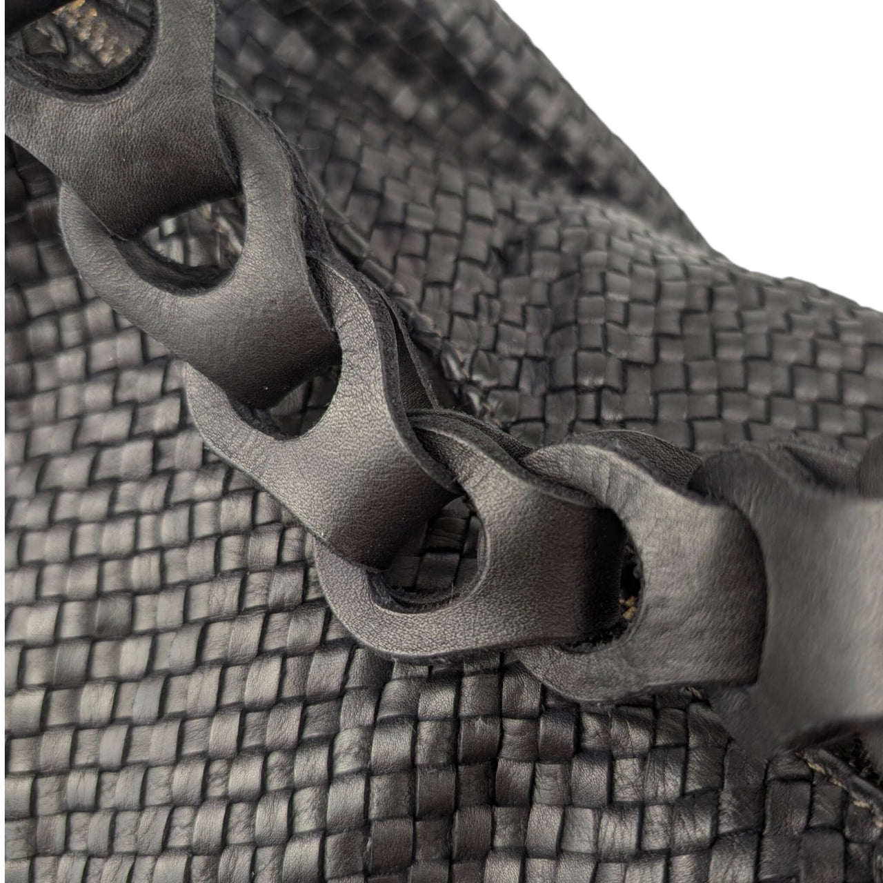 Black woven napa leather hobo bag, close-up of the braided top handle, House of Enira Talisca