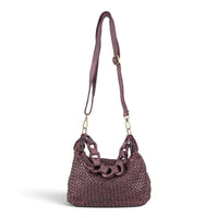 Burgundy woven leather shoulder bag with the long crossbody strap attached