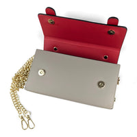 Long shaped purse with 2 belted details with top handle on a gold chain in smooth silky soft Italian leather in neutral taupe