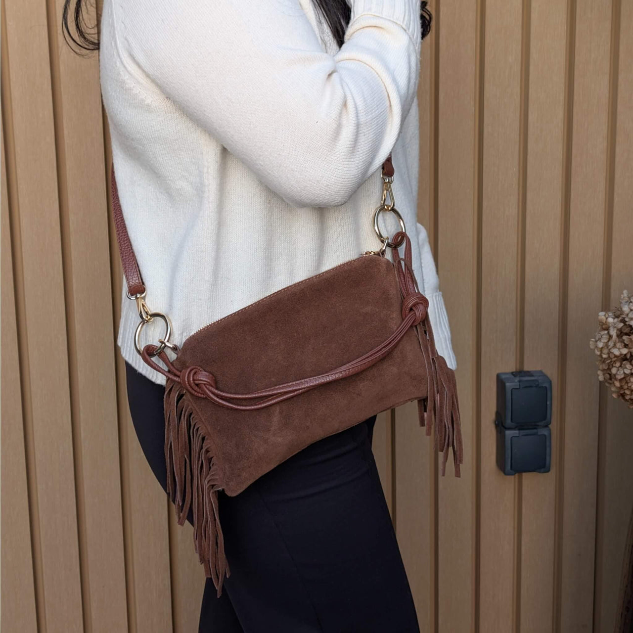 marron Italian suede bag with fringe, adjustable strap, and square-slouch shape