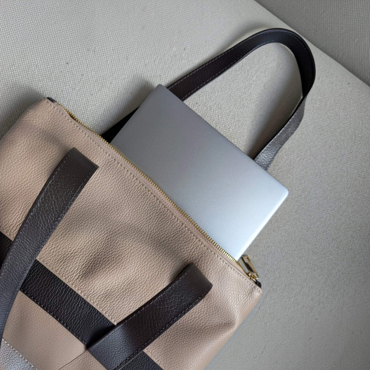 13-inch laptop slipped vertically into the dusty pink Liali pebbled leather shopper, House of Enira